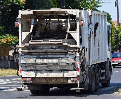 Manager preparing an internal review of a skip hire complaint